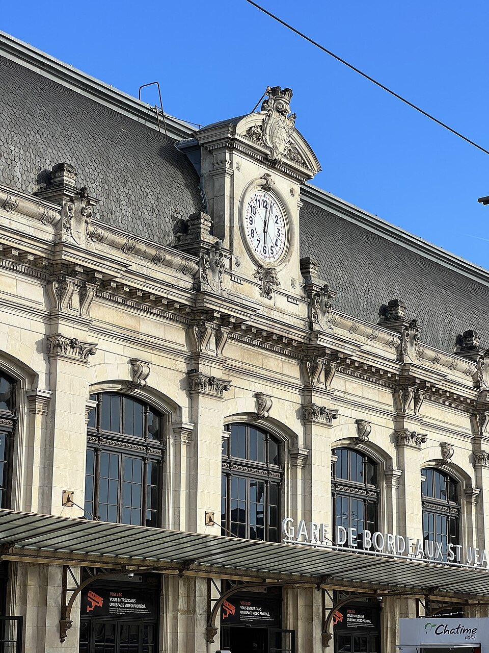 The front of Saint-Jean station under a blue sky